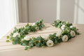 EucaLuxe™ 180cm Artificial Eucalyptus Garland with White Flowers – Elegant Hanging Décor